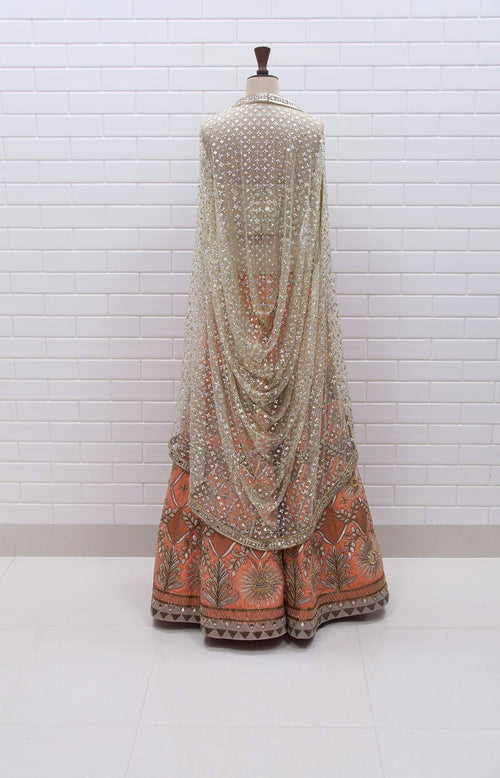 Peach Lehenga with Mirror Corset and Kundan cowl jacket